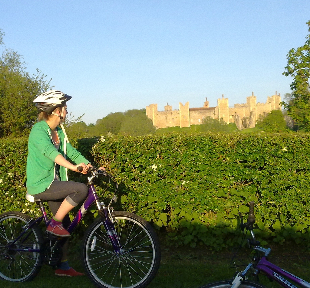 Cyclist admiring Framlingham Castle Suffolk by Xtrahead